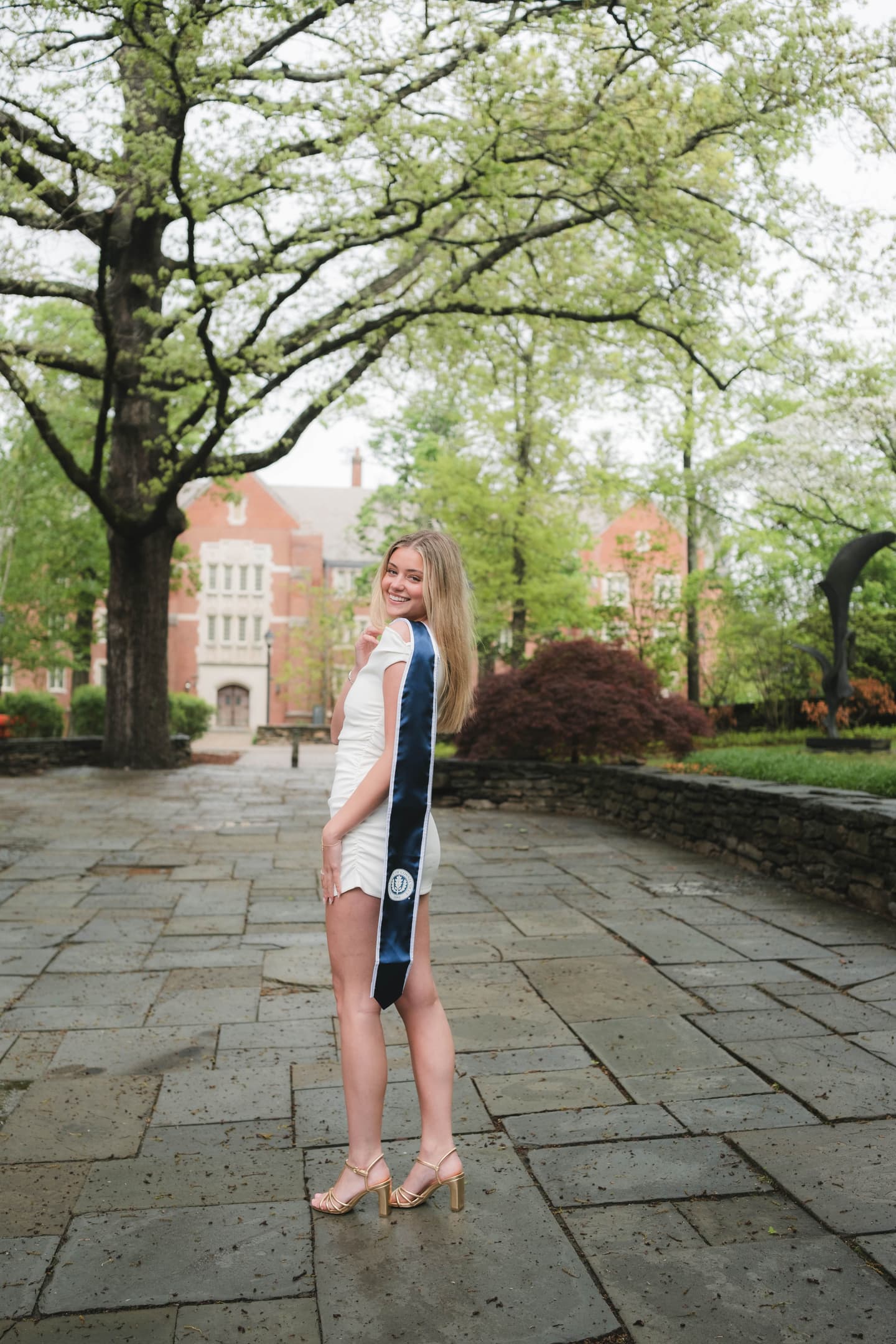 UConn student graduate poses for photo