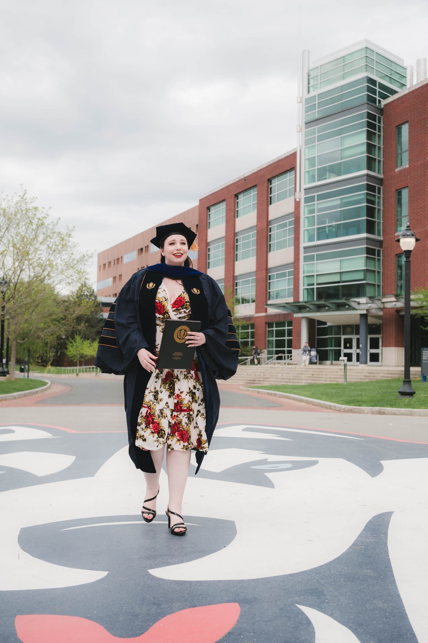 UConn student graduate walking on Fairfield Way